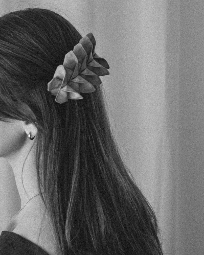 Black and white photo of the Origami Silk Butterfly Barrette Hair Clip on model.