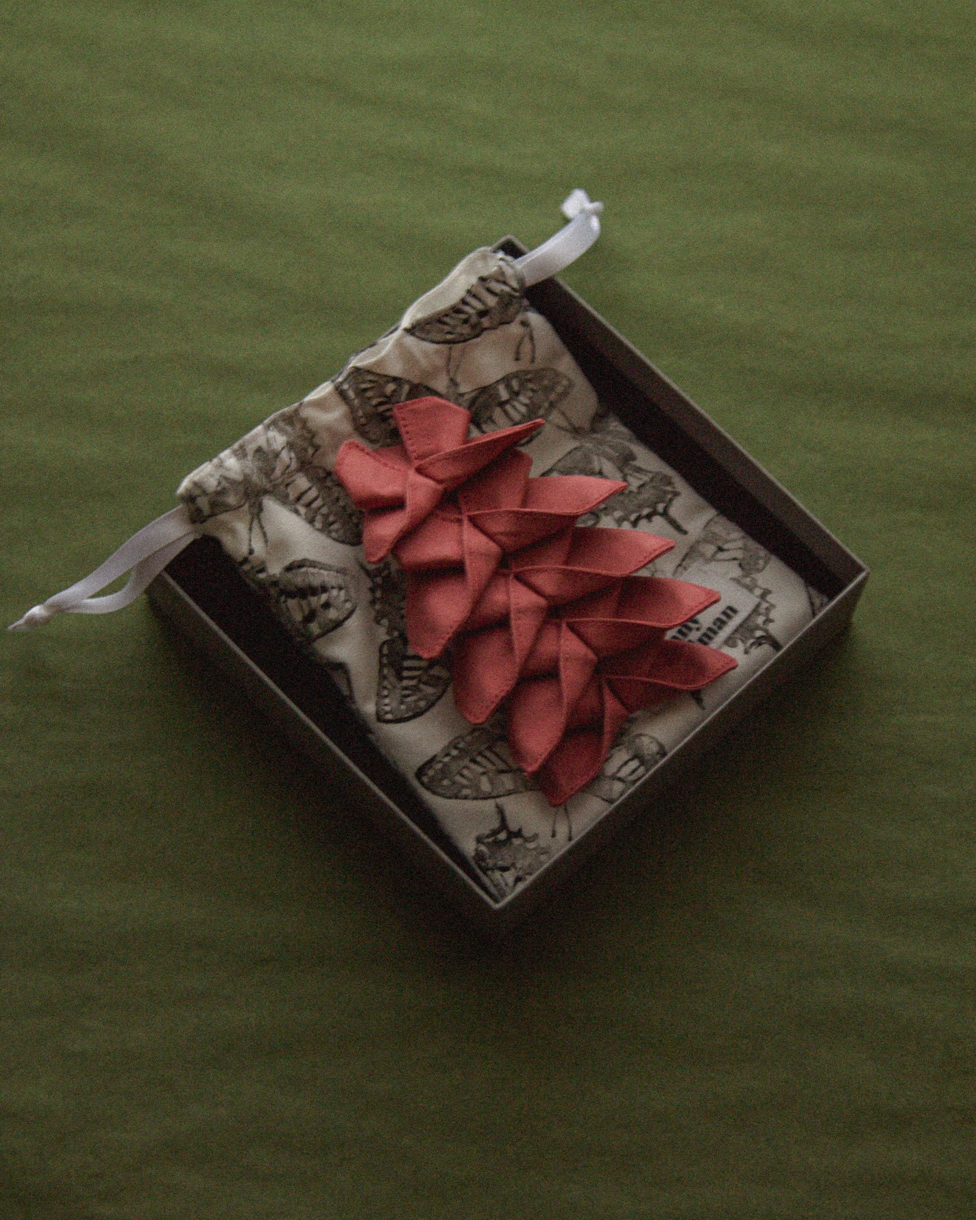 The hair clip is delivered in a beautiful jewelry box with our logo embossed on the lid. A small storage bag is also included inside the box.