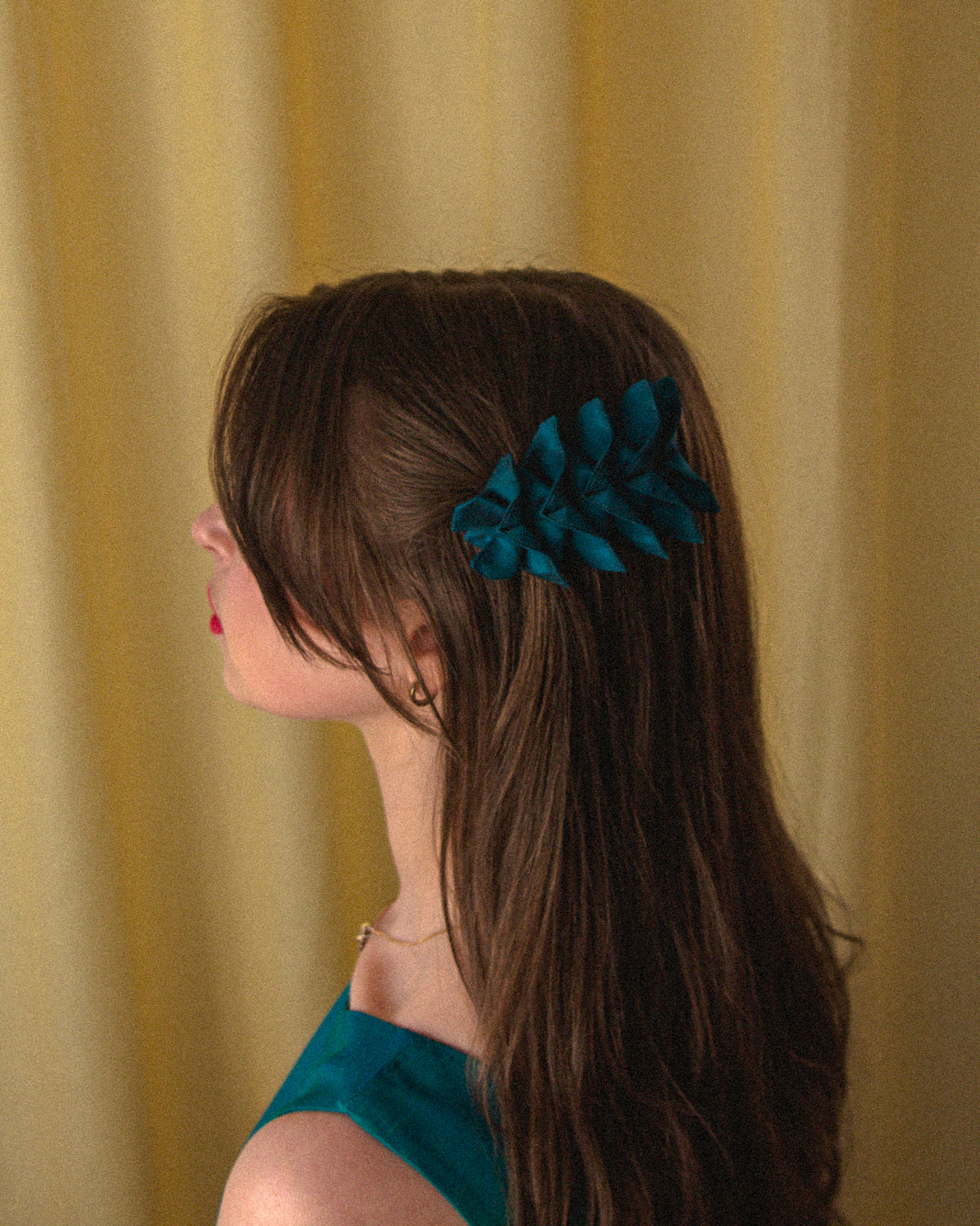 Origami Silk Butterfly Barrette Hair Clip in Dark Teal on model.