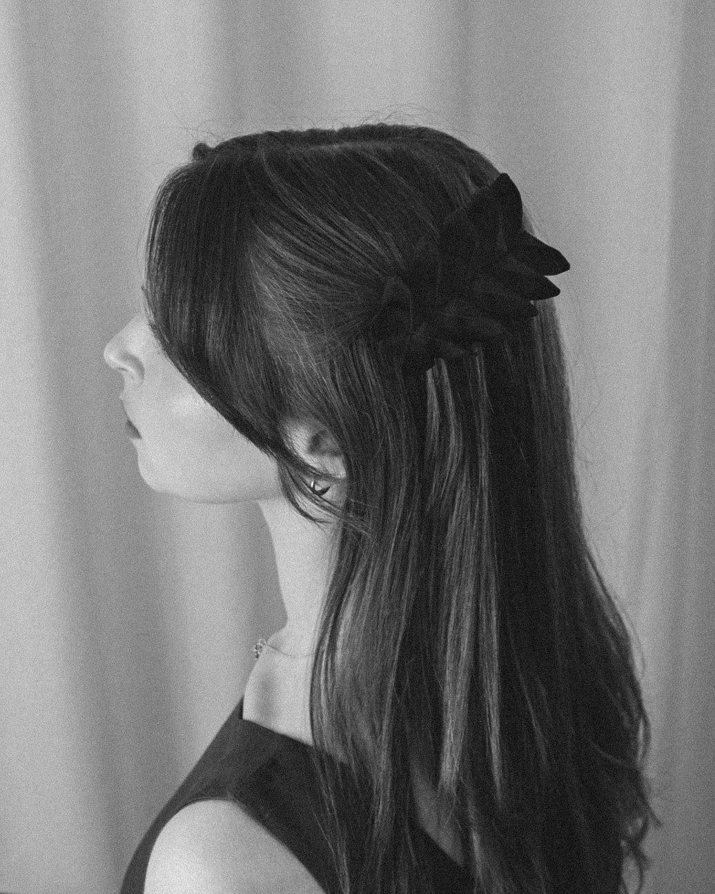 Black and white photo of the Origami Silk Butterfly Barrette Hair Clip on model.