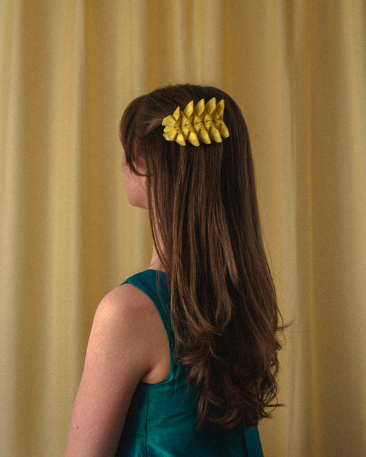 Origami Silk Butterfly Barrette Hair Clip in Butter Yellow on model.