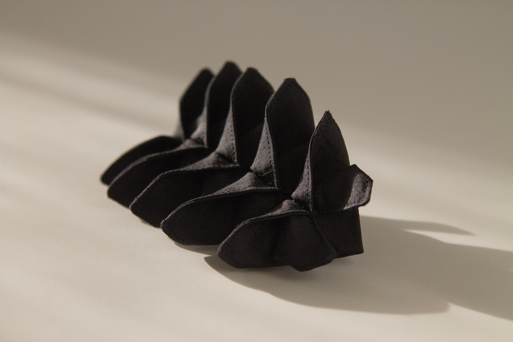 Origami Silk Butterfly Barrette Hair Clip in Black on white background.