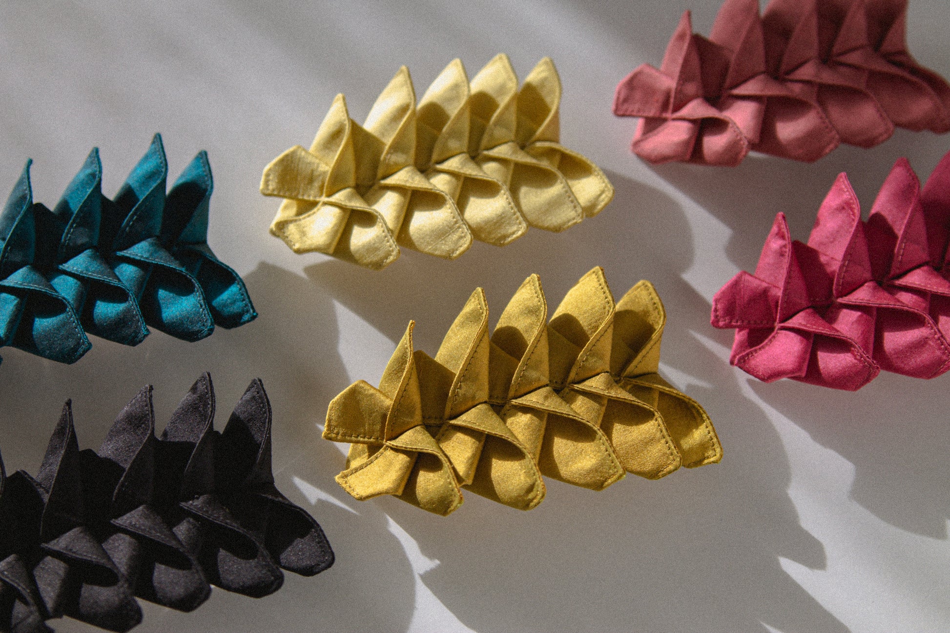 All the different colors of the Origami Silk Butterfly Barrette Hair Clip on white background.